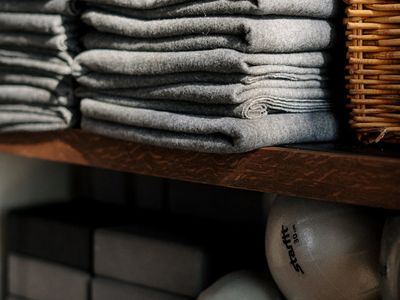 Yoga block and a towel on a dark background